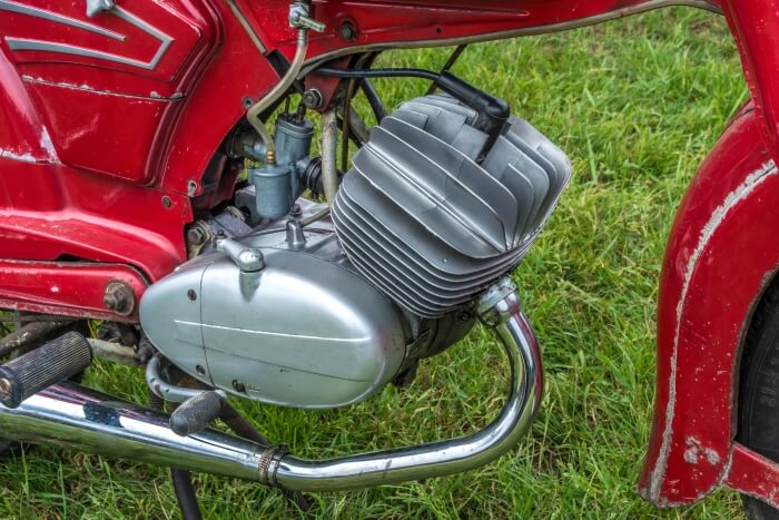 Classic two-stroke engine on a moped with mixture lubrication